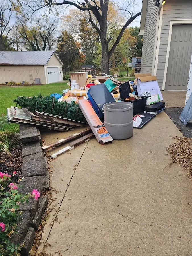 Dumpster being loaded with debris for 3 Yard Dumpster Rental in Belmar